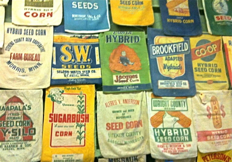 a large pile of vintage t - shirts displayed on the wall
