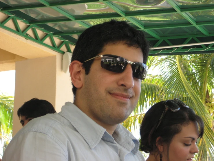 a man that is wearing a pair of sunglasses