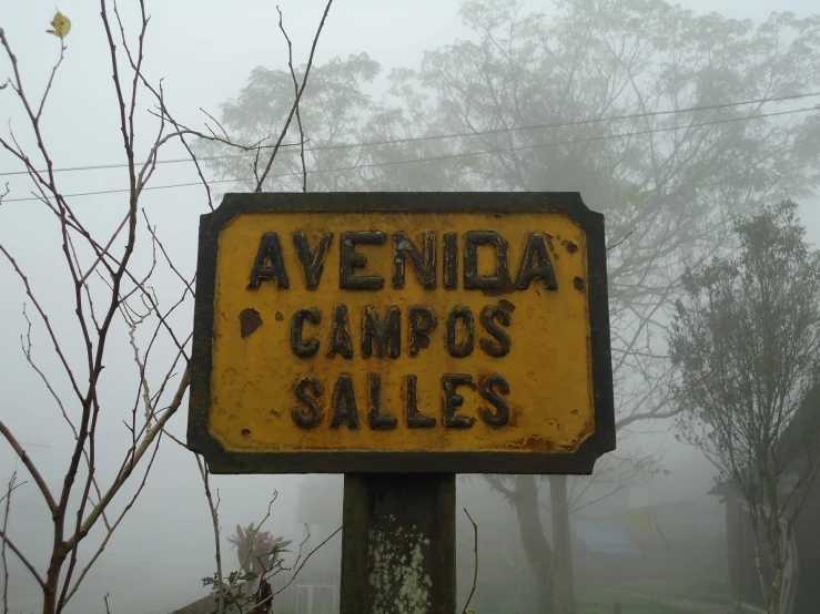 a street sign is in front of some houses