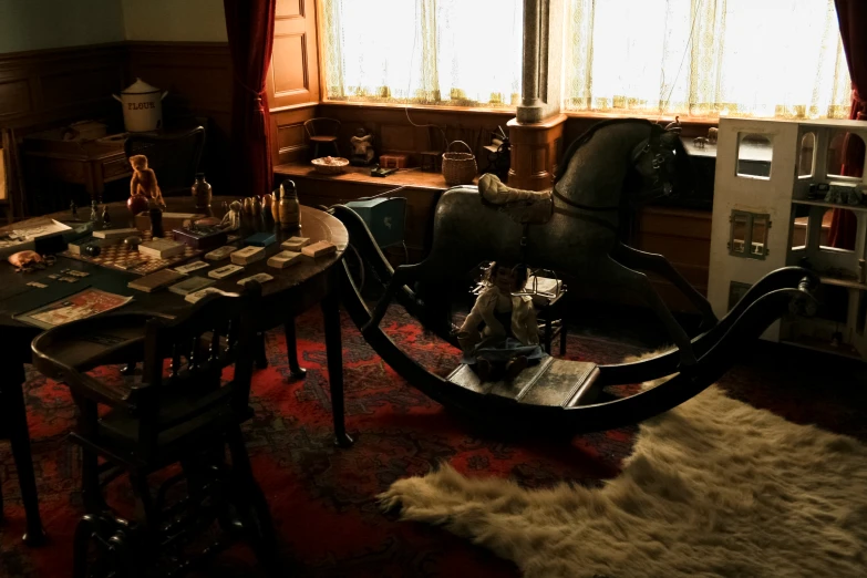 an antique horse standing on a table in a living room