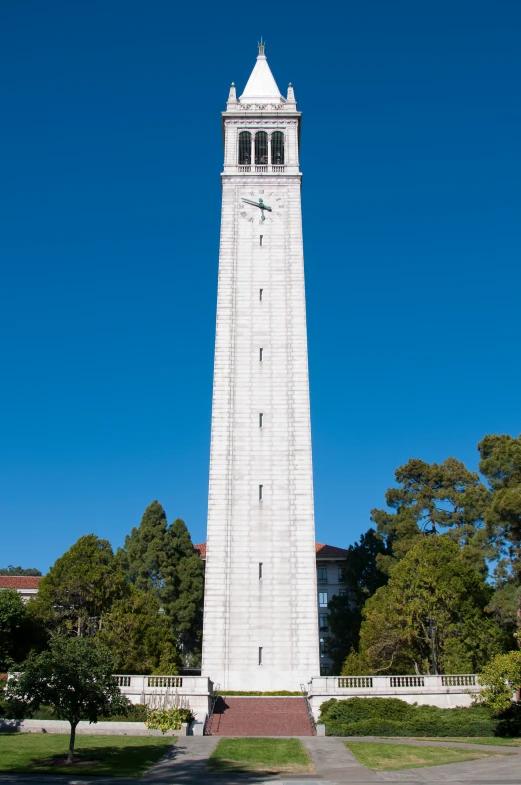 the white building has a clock tower on it