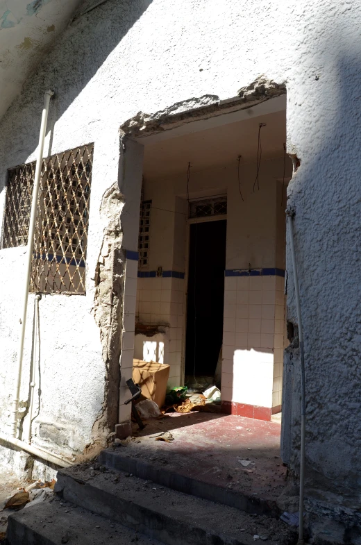 the front entrance of a building is being demolished