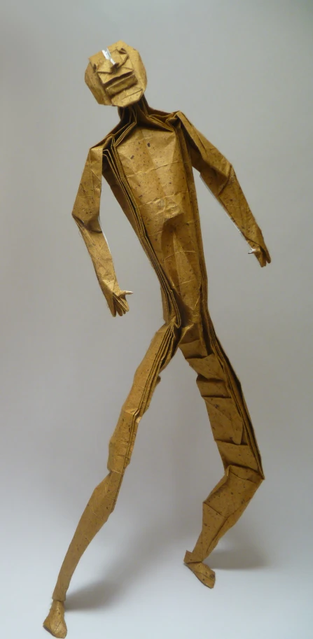 a paper model of a person in yellow