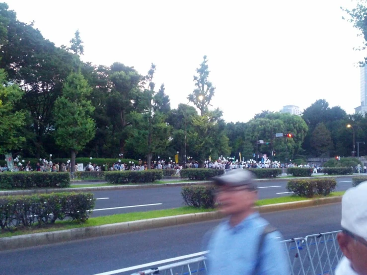 a person wearing a hat is crossing the street