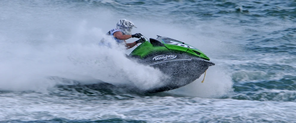 a person on a jet ski in the ocean