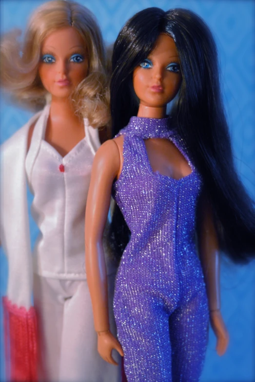 a close up of two dolls next to each other