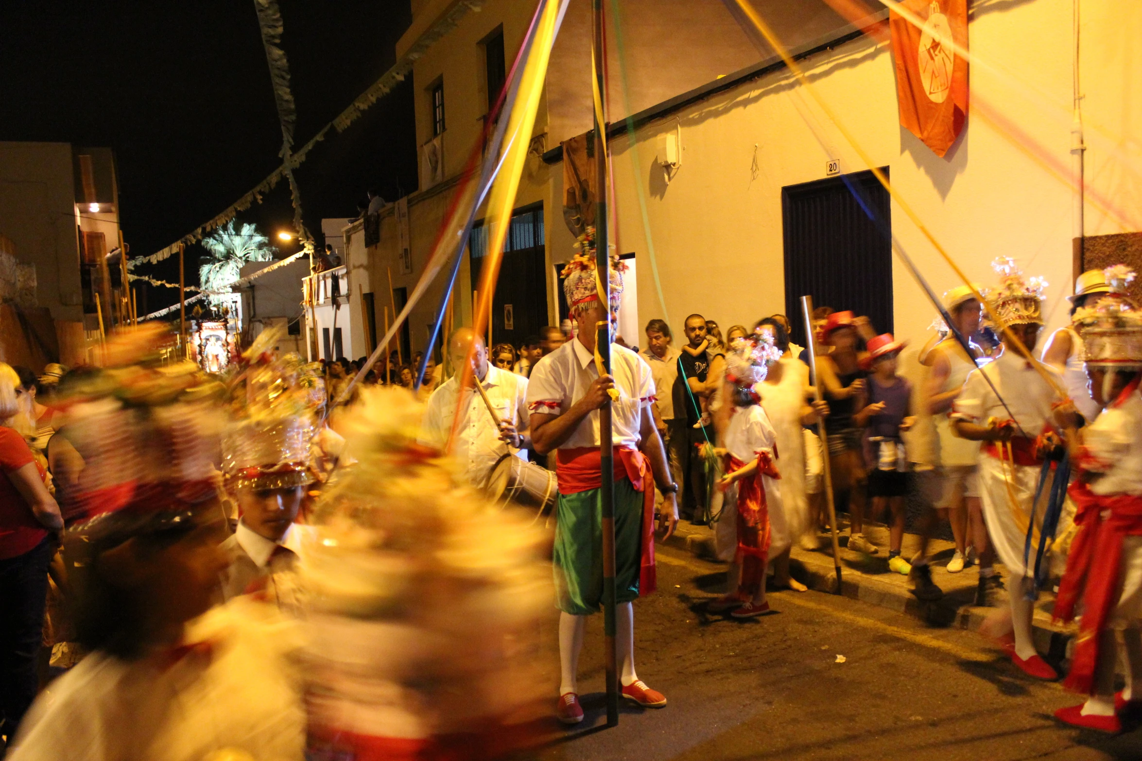 a large crowd of people in costumes and hair