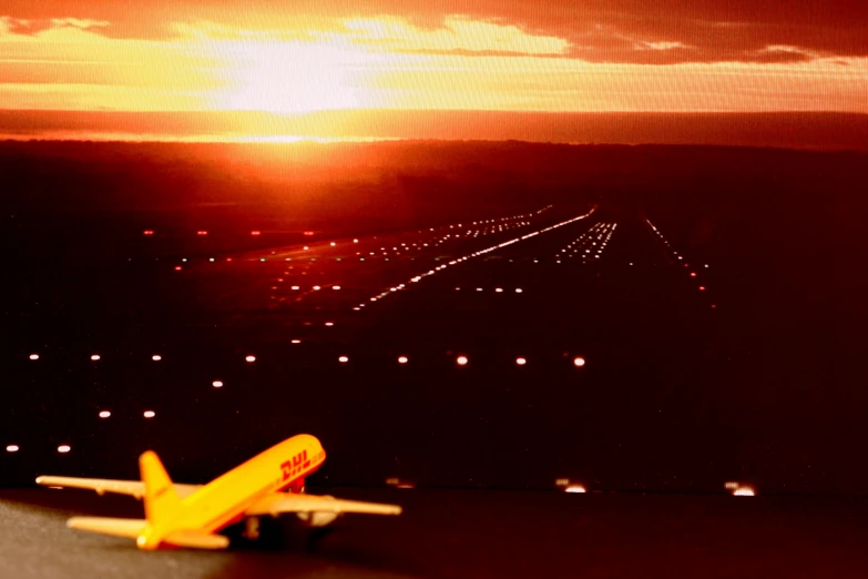 small toy airplane with lightening beams in background