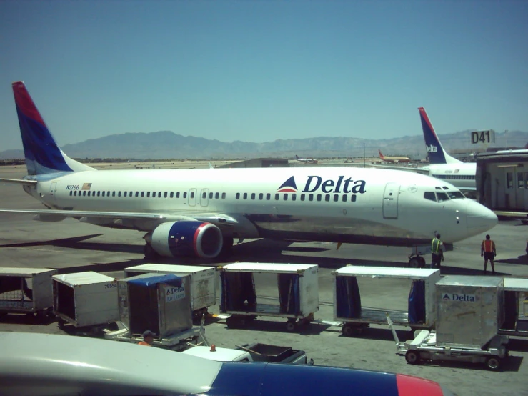 an airplane at the airport being boarded