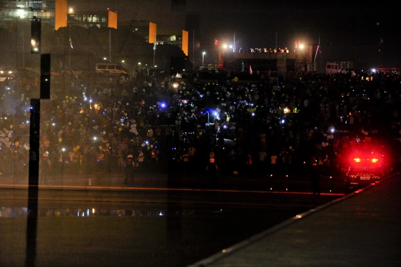 a large crowd is gathered outside the building