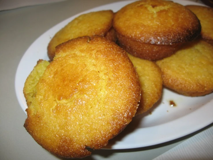 some type of fried doughnut that is on a plate