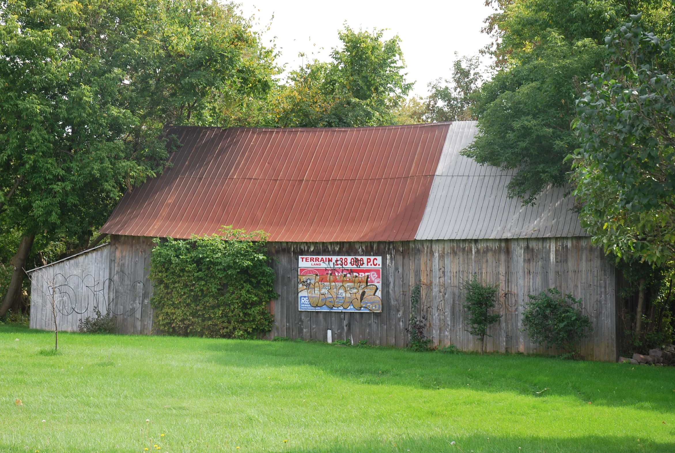 a red roof on an old wooden building