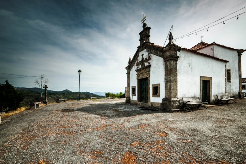 an old church with a clock tower is vacant