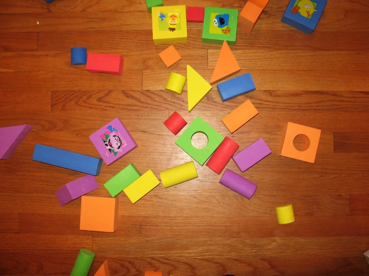 different colored blocks are displayed in an arrangement on a floor