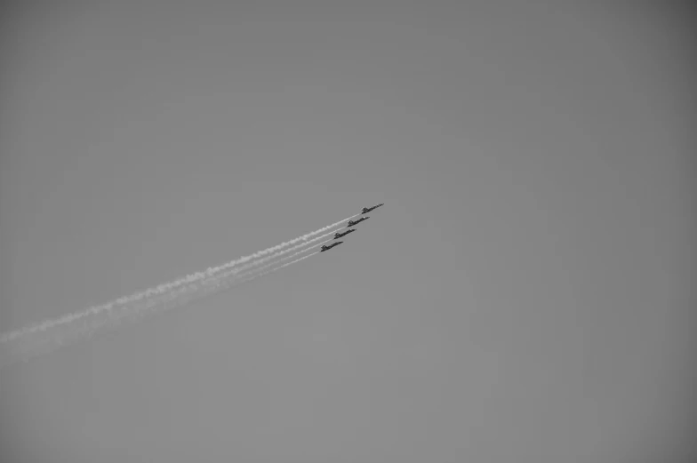 two planes that are flying in the air