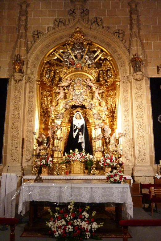 the altar at an altar - top church with a large statue