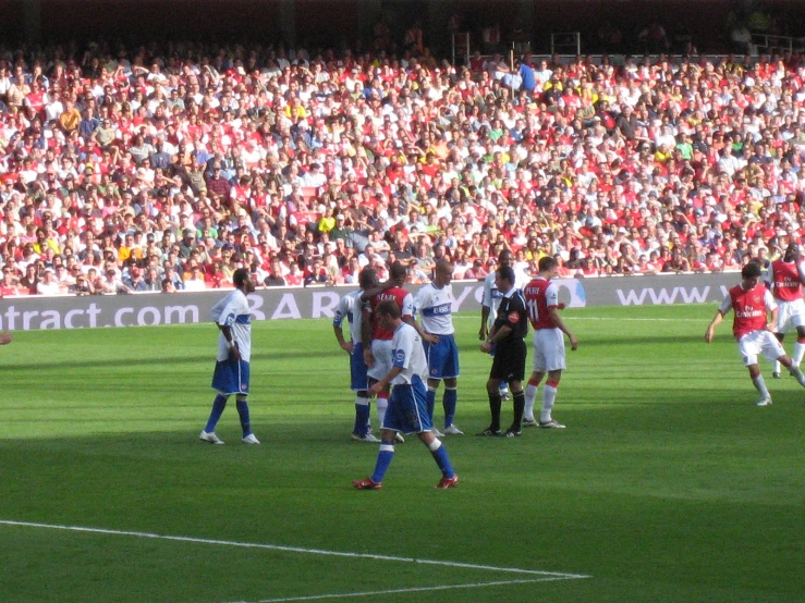 a soccer game is underway on the field