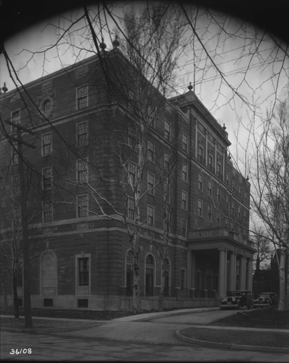 the historic brick building on a street corner in winter