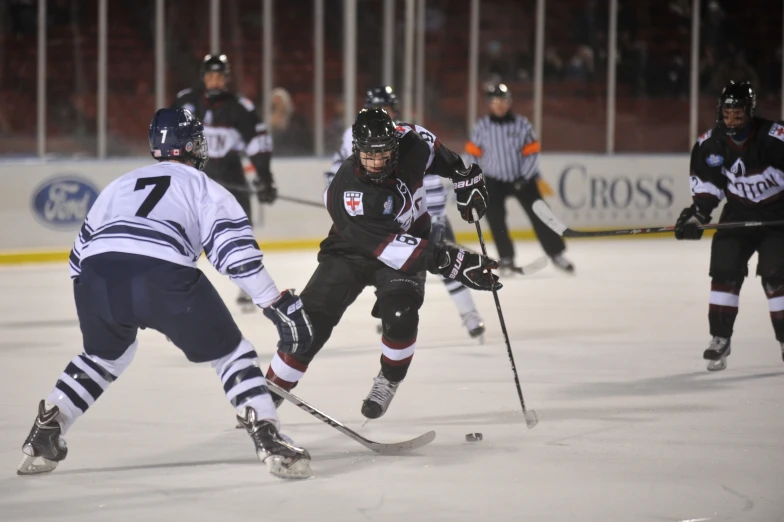 an ice hockey game being played in a stadium