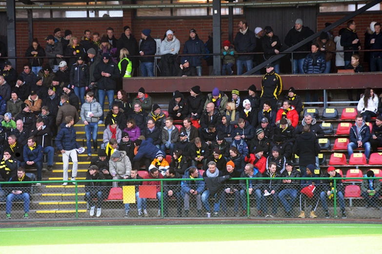 several people dressed in black at a sporting event