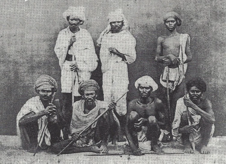 a black and white image of a group of men standing