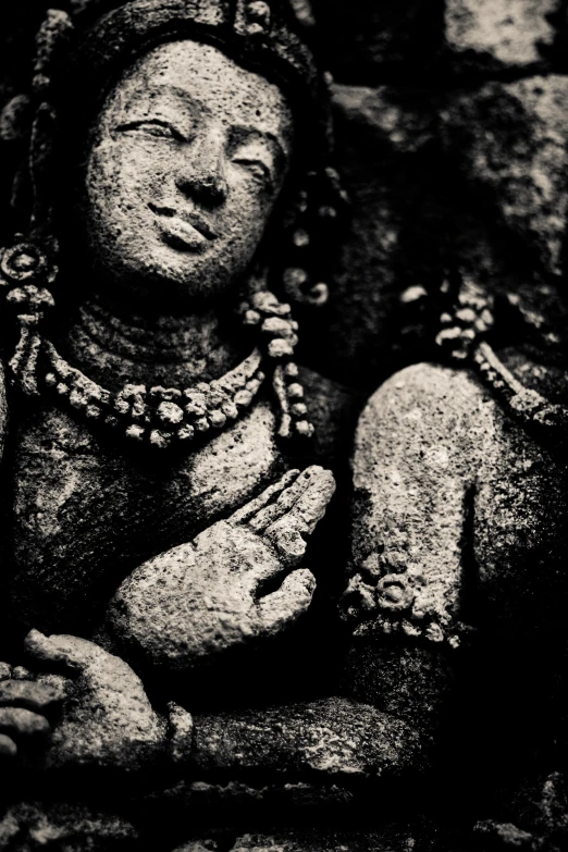 black and white image of a buddha statue