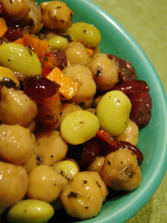 this is a bowl with a colorful mixture of fruit in it