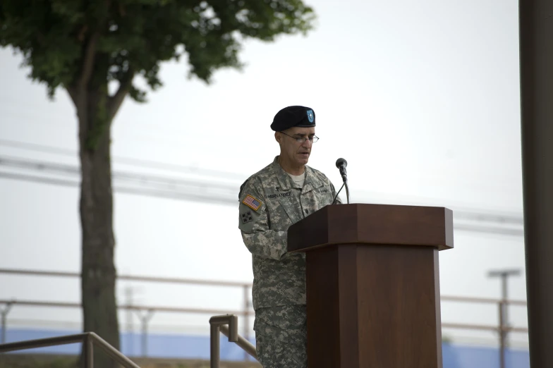 an image of a military man speaking from the podium