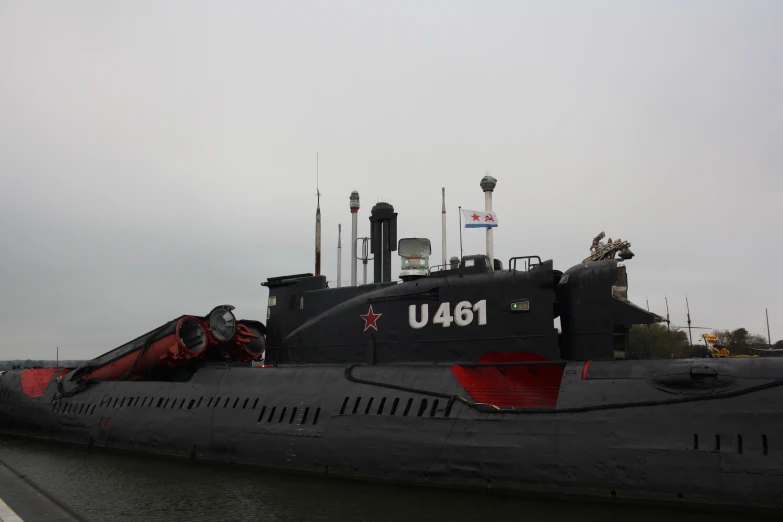 a submarine in water near a light house