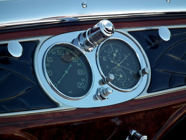 a meter and gauges are mounted on the dashboard of an old car