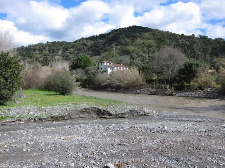 a big hill side has a house in it