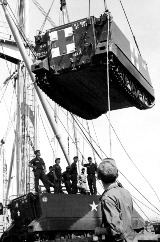 black and white po of men on top of a boat