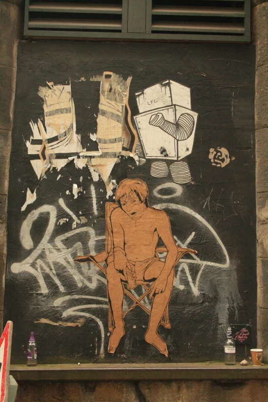 a person is on the wall in front of graffiti