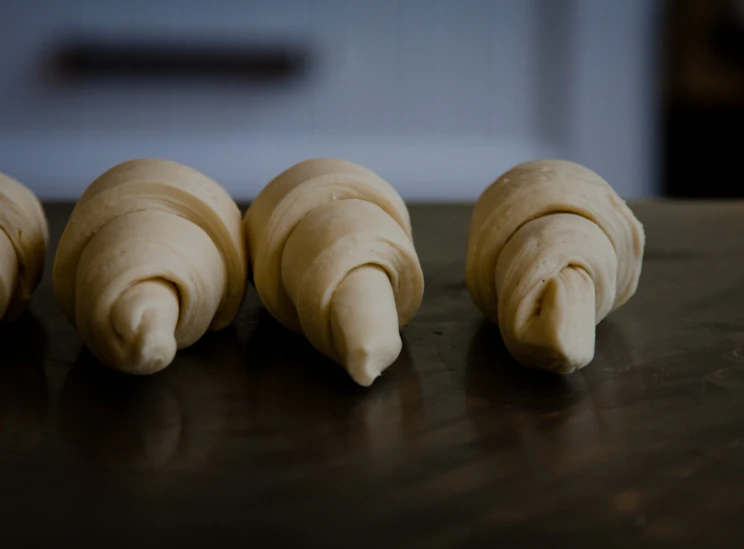 a bunch of uncooked bananas sitting on a table