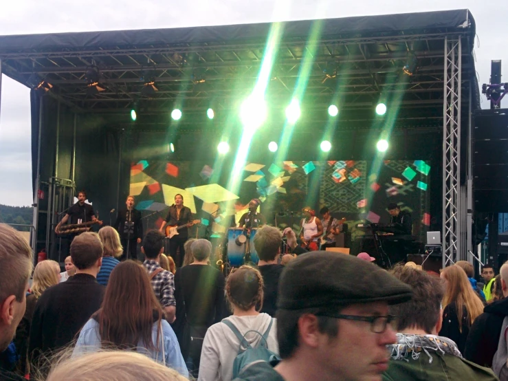 a stage with many people on it at night