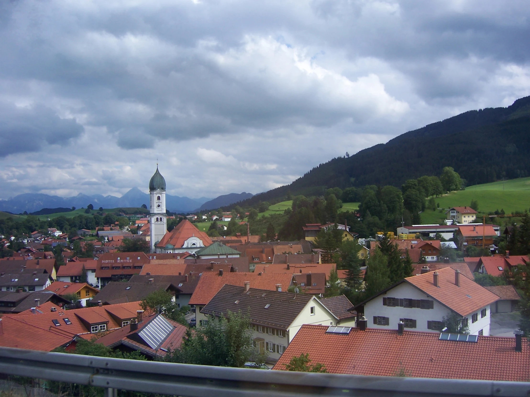 a scenic po taken from a balcony over a city