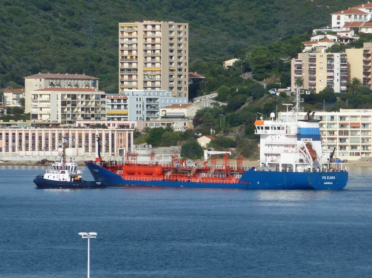 two cargo ships are passing through the water