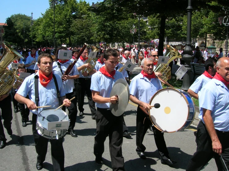 marching ensemble in the street marching on a sunny day