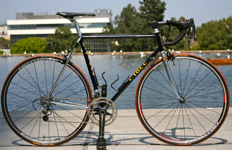 an old bike is  up on the sidewalk