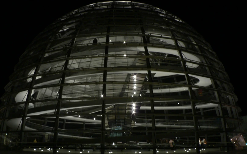 the view of a building at night from underneath it