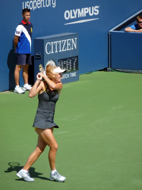 a tennis player on the court getting ready to serve