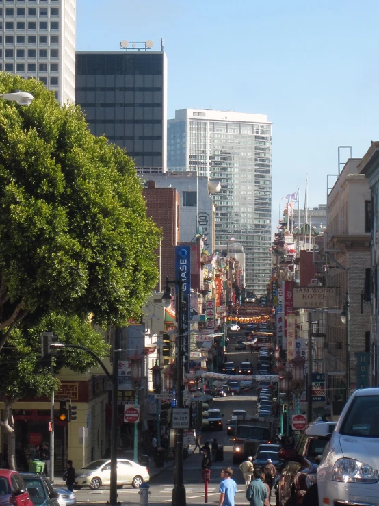 a busy city street with traffic and pedestrians