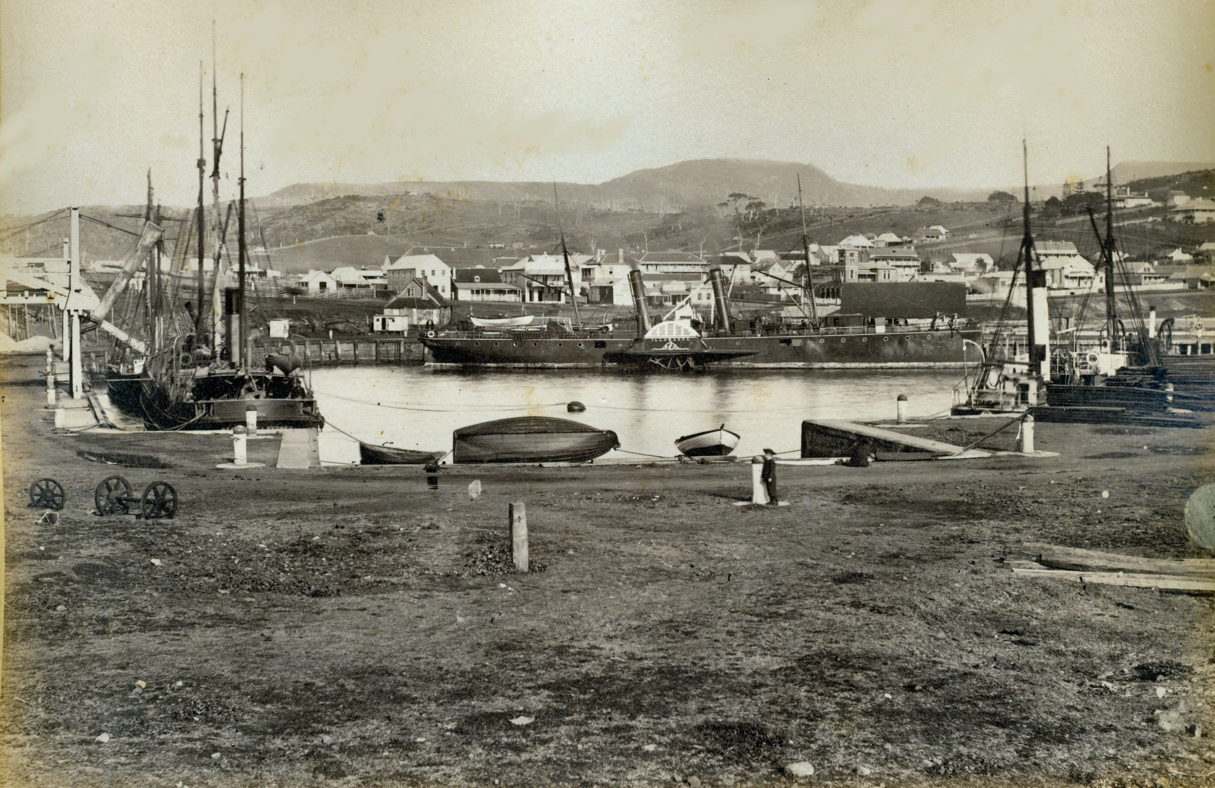 a boat docked in an area with other boats