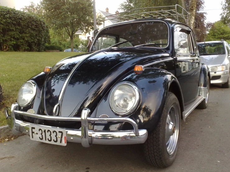 a volkswagen beetle that is parked on a street