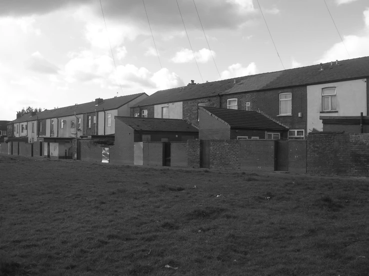 a black and white image of several empty homes
