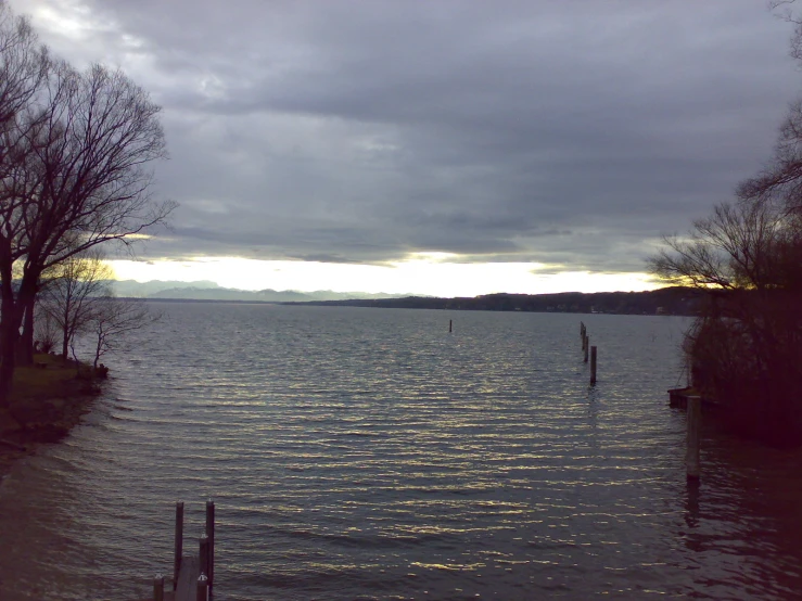 clouds roll in and there is a lake