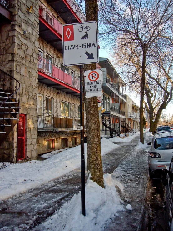 a street corner with cars parked on both sides