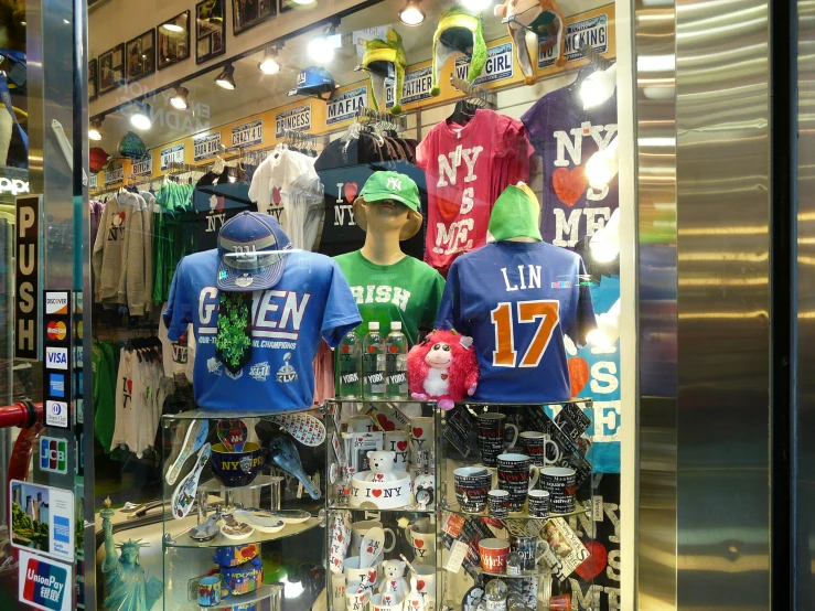 an assortment of sports jerseys in a shop window