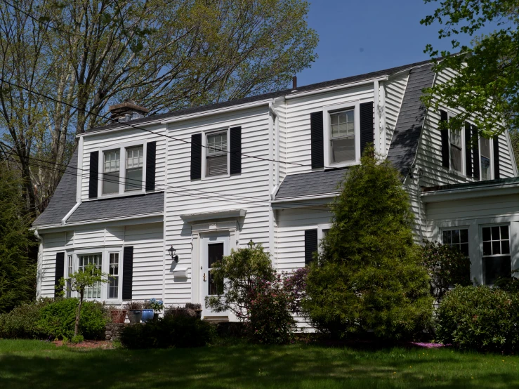 a white house with many windows on a sunny day