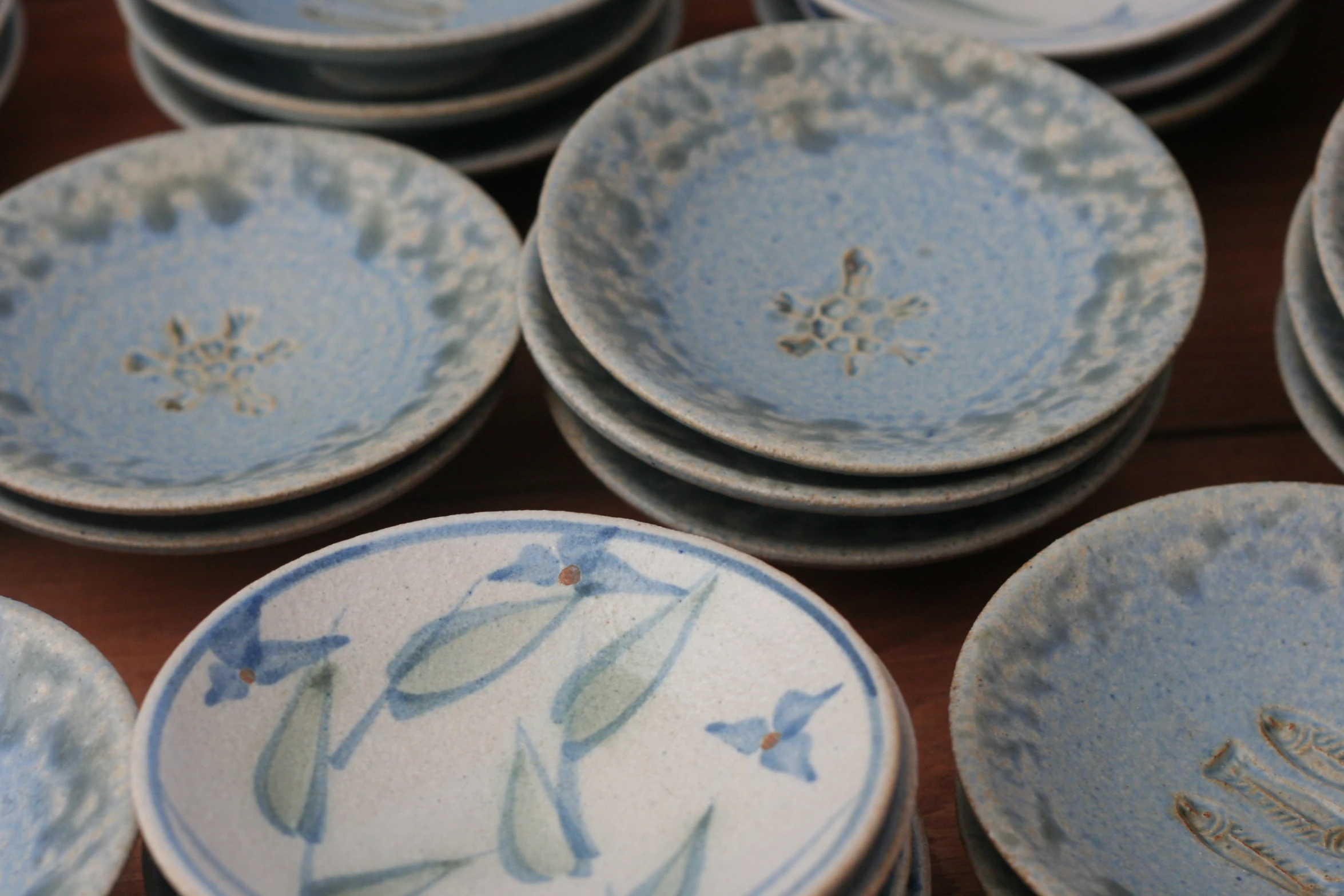 a close up of several blue and white plates